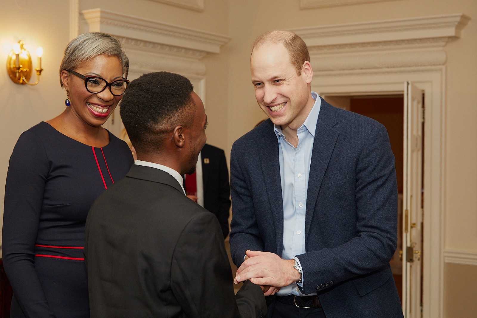 Erick gets congratulated by Prince William